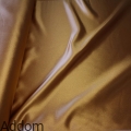 Złoty materiał zasłonowy satynowy.jpg