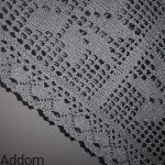 Obrus dziergany ze srebrnej przędzy